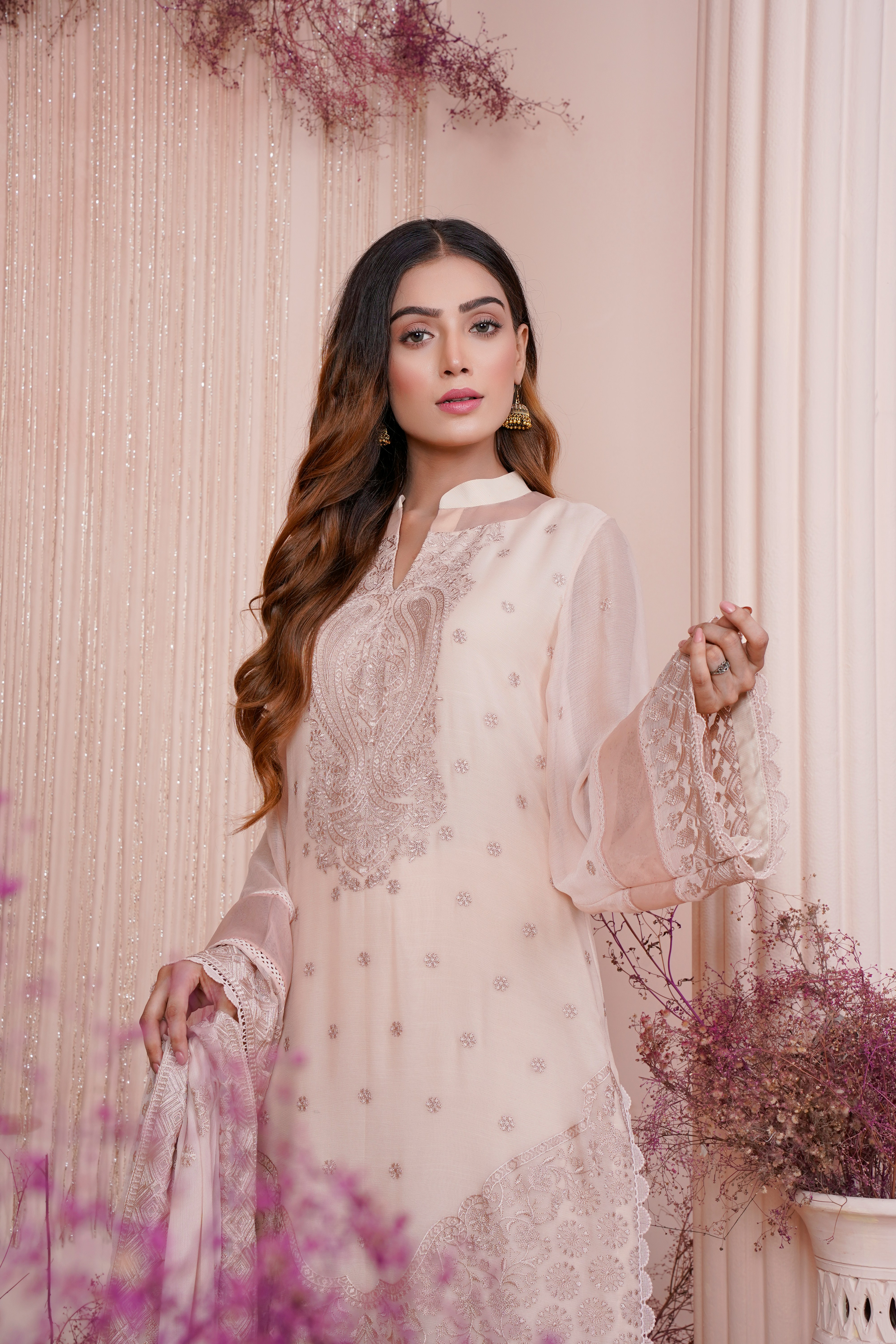 Model wearing a new Poshak Mandi suit